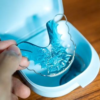Retainer in blue carrying case